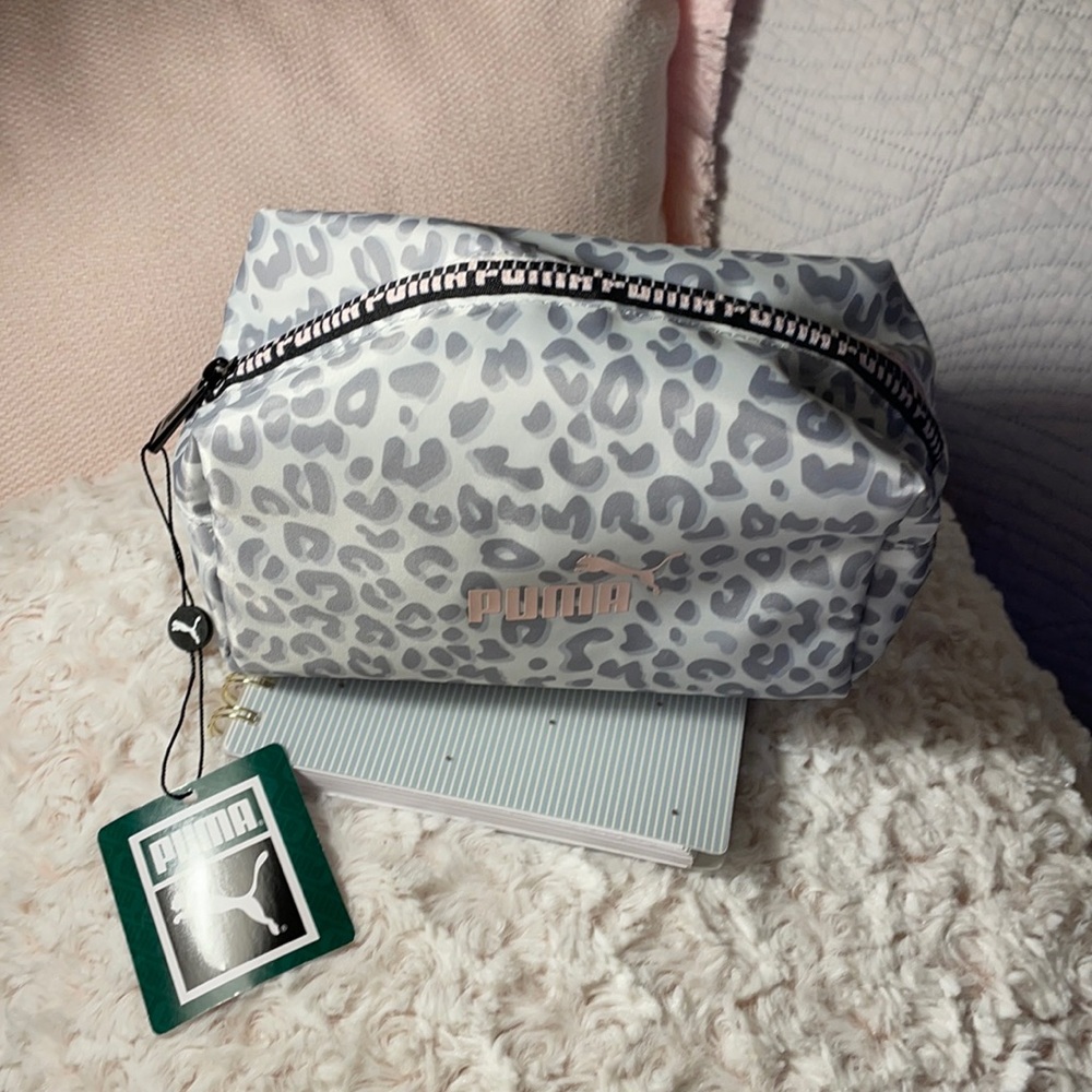 Puma “leopard” print cosmetic bag.